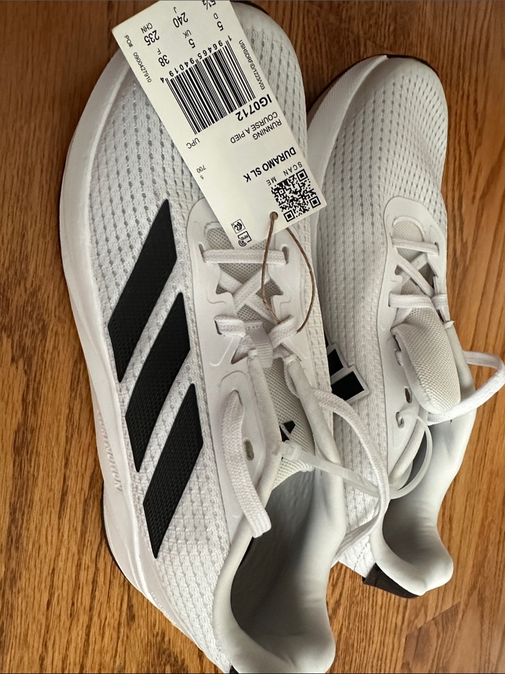 Adidas White Running Shoes with Black Stripes